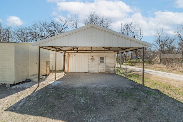 view of outbuilding featuring a carport