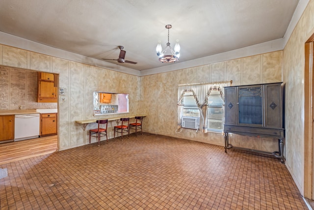 interior space with ceiling fan with notable chandelier