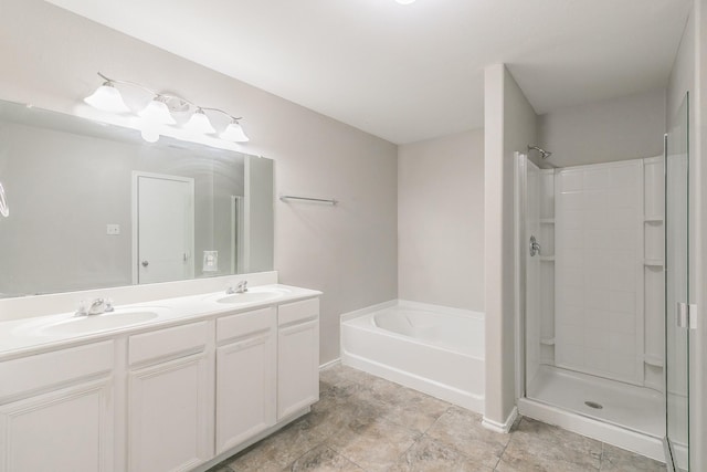 bathroom with vanity and separate shower and tub