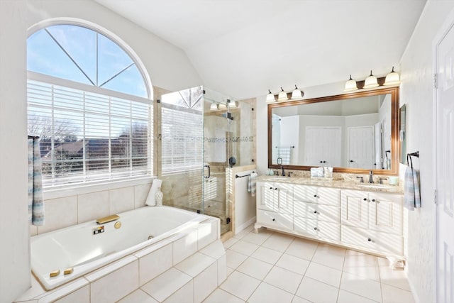 bathroom with tile patterned floors, vanity, shower with separate bathtub, and lofted ceiling