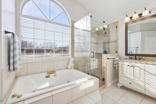 bathroom with vanity, tile patterned floors, and separate shower and tub