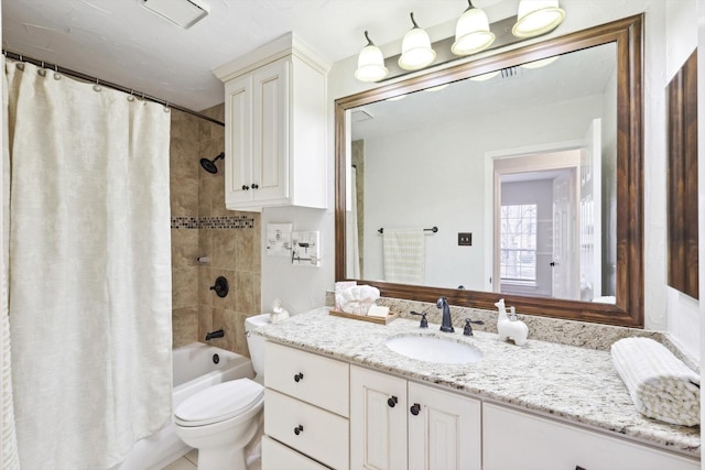 full bathroom featuring vanity, toilet, and shower / tub combo with curtain