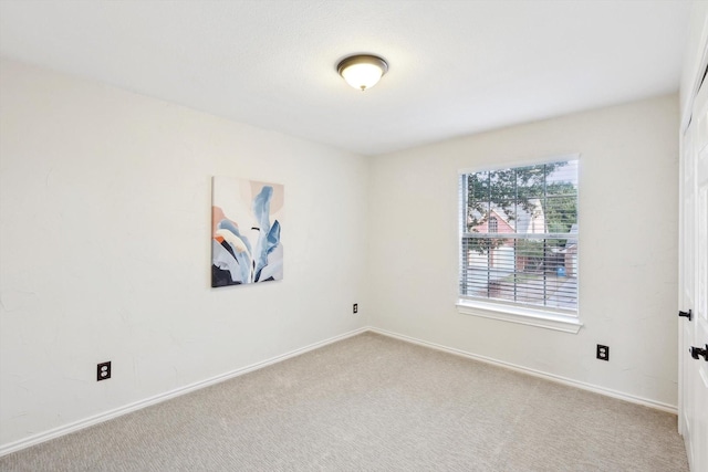 spare room featuring carpet flooring