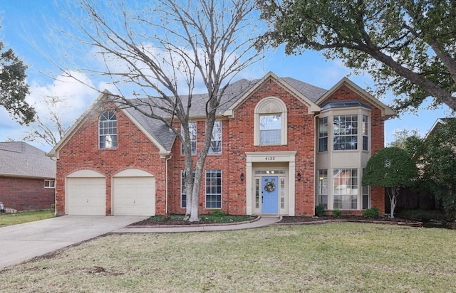 view of front facade featuring a garage and a front lawn