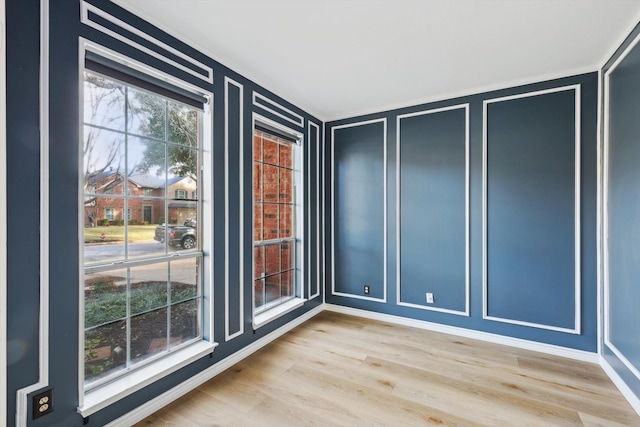 unfurnished room featuring hardwood / wood-style flooring