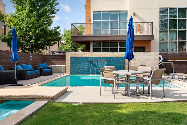 view of pool with fence, an outdoor hangout area, a fenced in pool, and a patio