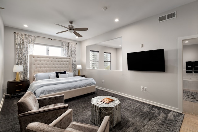 bedroom with baseboards, visible vents, ensuite bath, ceiling fan, and recessed lighting