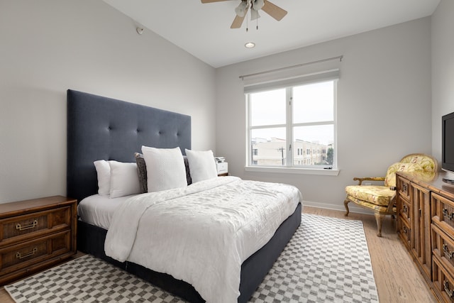 bedroom with light wood-type flooring, ceiling fan, baseboards, and recessed lighting