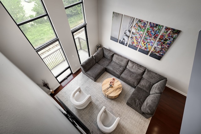 living area featuring baseboards and wood finished floors