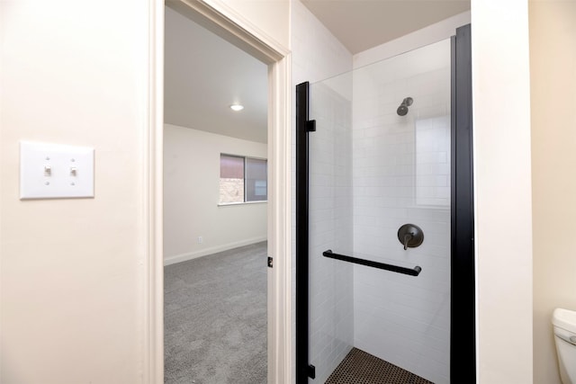 bathroom with walk in shower and toilet