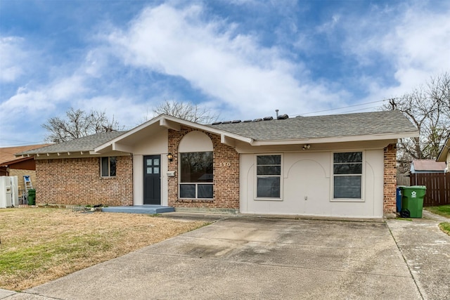 ranch-style home with a front lawn