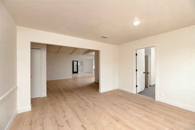 unfurnished room with light hardwood / wood-style flooring