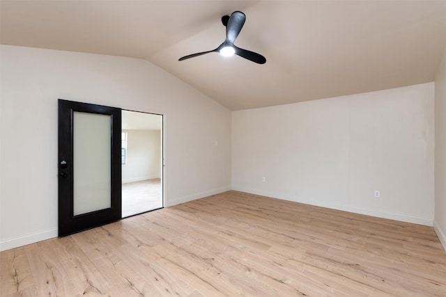 unfurnished room featuring ceiling fan, lofted ceiling, and light hardwood / wood-style floors