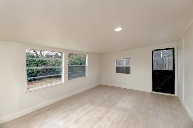 unfurnished room with light hardwood / wood-style flooring