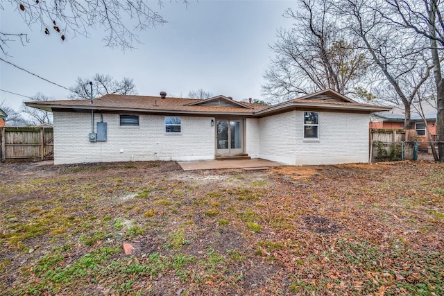 rear view of property featuring a patio