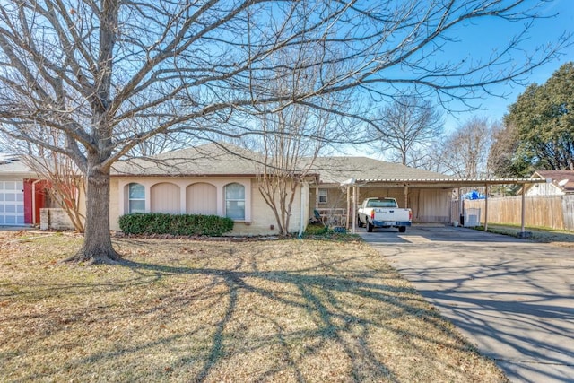 single story home featuring a front lawn and a carport