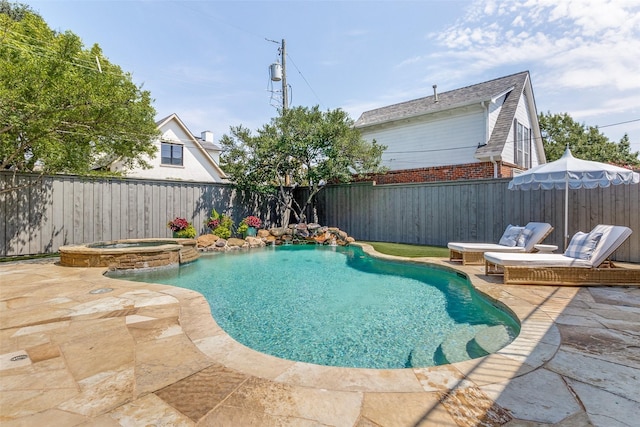 view of pool featuring an in ground hot tub and a patio