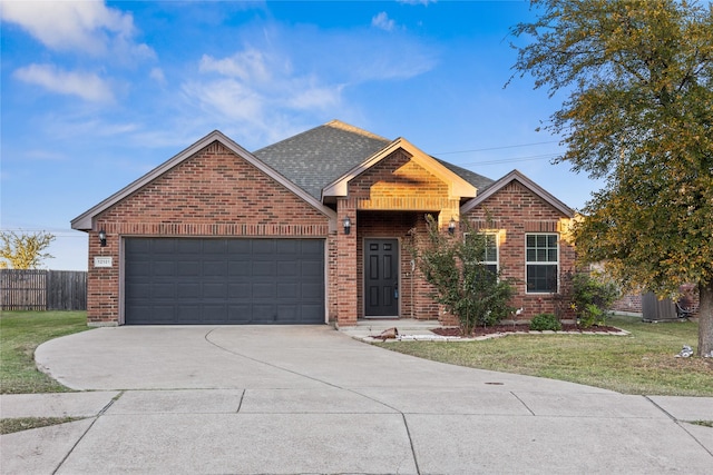 view of front facade with a garage and a front yard