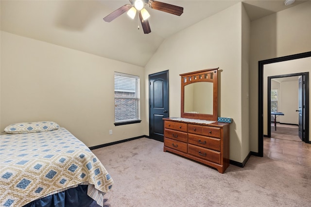 carpeted bedroom featuring vaulted ceiling and ceiling fan