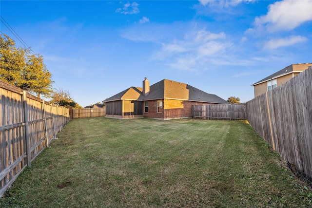 view of yard featuring a sunroom