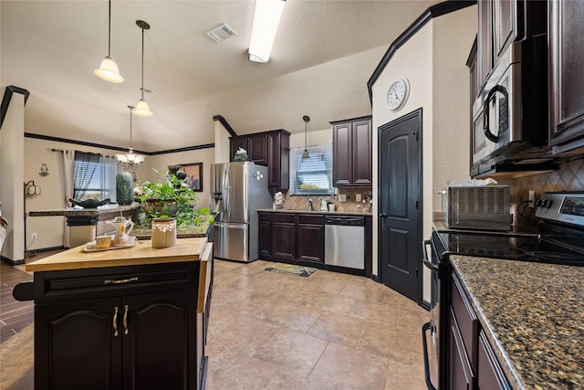 kitchen featuring a kitchen island, wood counters, decorative light fixtures, stainless steel appliances, and dark brown cabinets