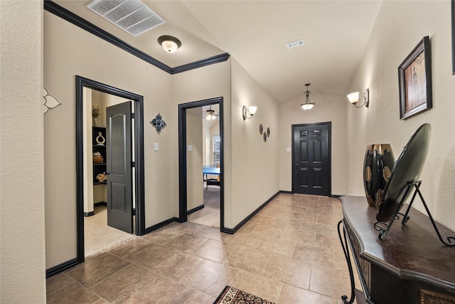 entrance foyer with vaulted ceiling