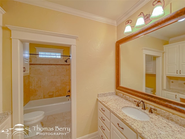 full bathroom with ornamental molding, toilet, tiled shower / bath combo, and vanity