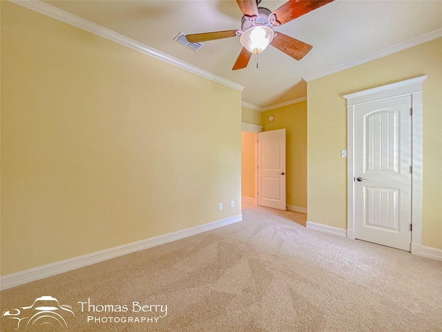 unfurnished bedroom featuring crown molding, light carpet, and ceiling fan