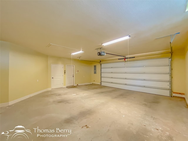 garage featuring a garage door opener and electric panel