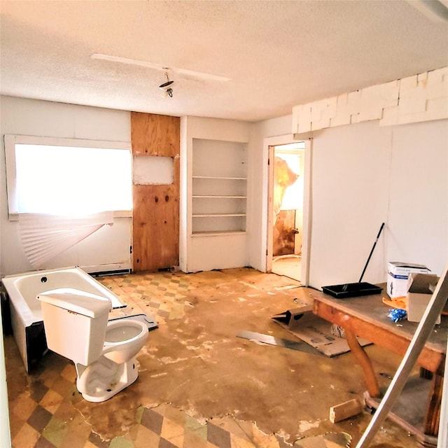 misc room featuring a textured ceiling