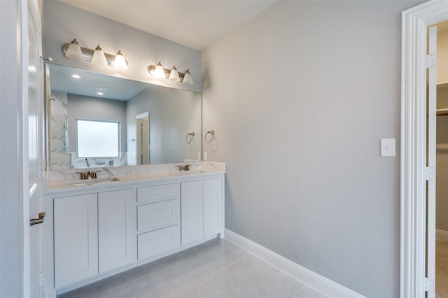 bathroom with vanity and tile patterned floors