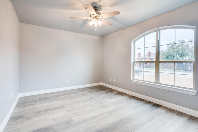 empty room featuring light hardwood / wood-style floors and ceiling fan