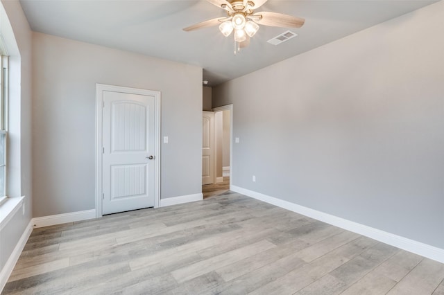 unfurnished bedroom featuring ceiling fan and light hardwood / wood-style floors