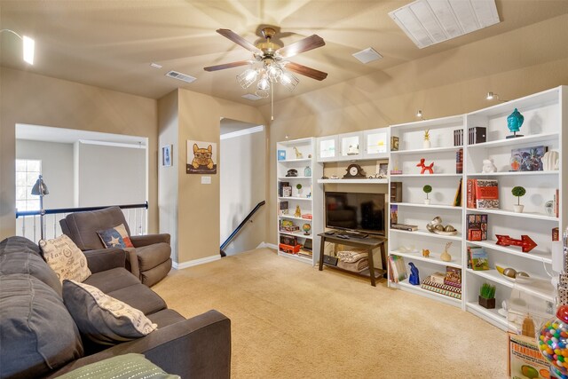 carpeted living room featuring ceiling fan