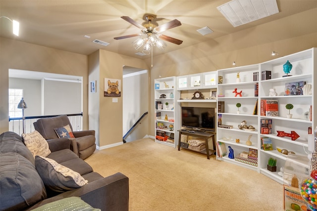 living room featuring light carpet and ceiling fan