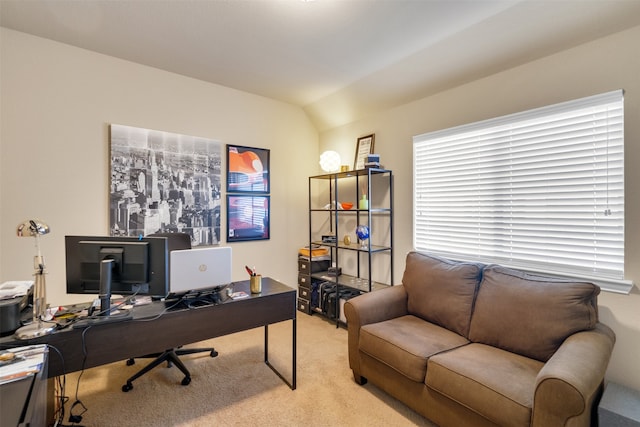 office area featuring light colored carpet and vaulted ceiling