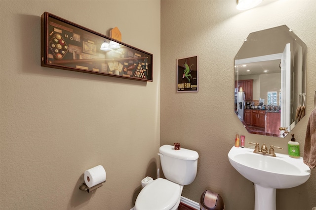 bathroom with sink and toilet