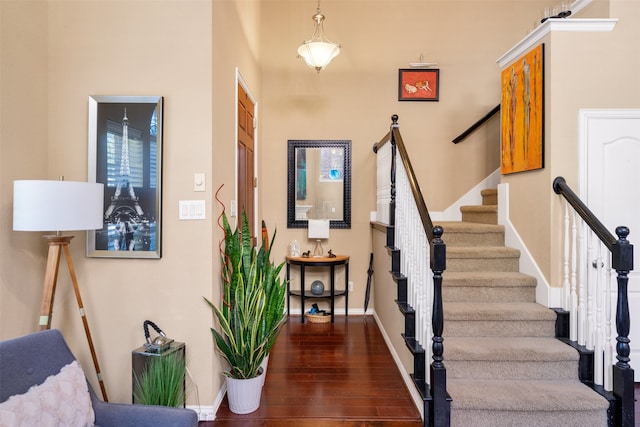 stairway featuring hardwood / wood-style floors