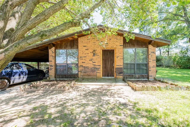 exterior space with a carport