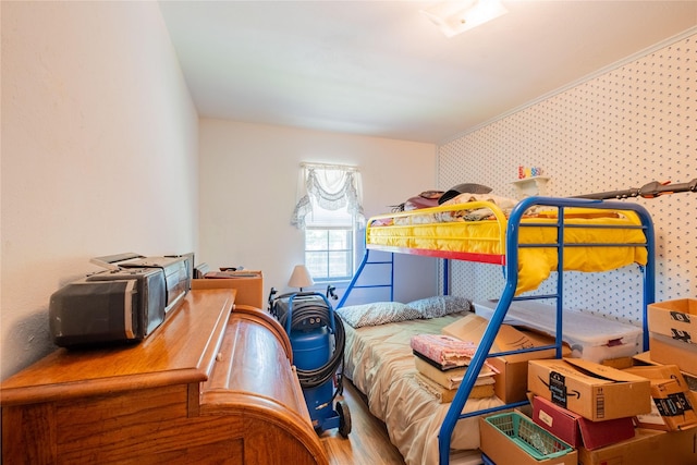 bedroom with hardwood / wood-style floors