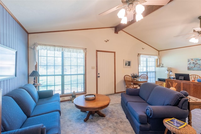 living room featuring ceiling fan, ornamental molding, light carpet, and vaulted ceiling with beams