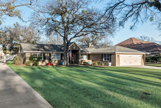 ranch-style house with a garage and a front lawn