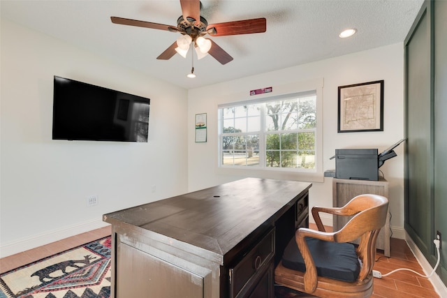 office featuring wood-type flooring, a textured ceiling, and ceiling fan