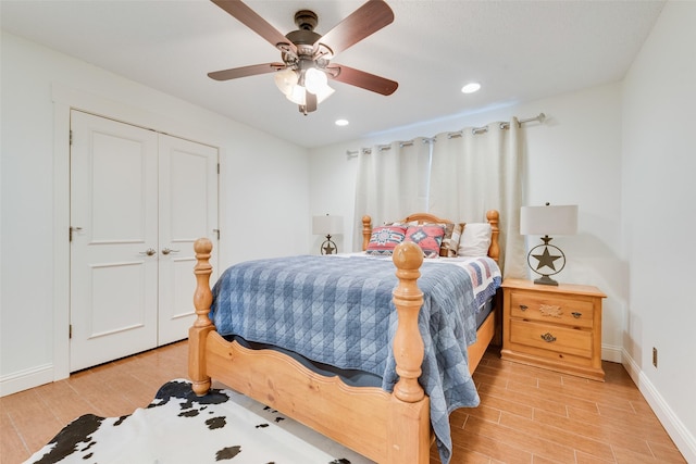 bedroom with ceiling fan and a closet