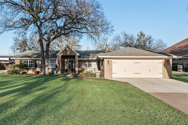 single story home featuring a garage and a front lawn