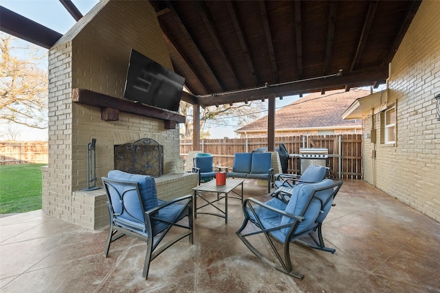 view of patio / terrace featuring an outdoor living space with a fireplace