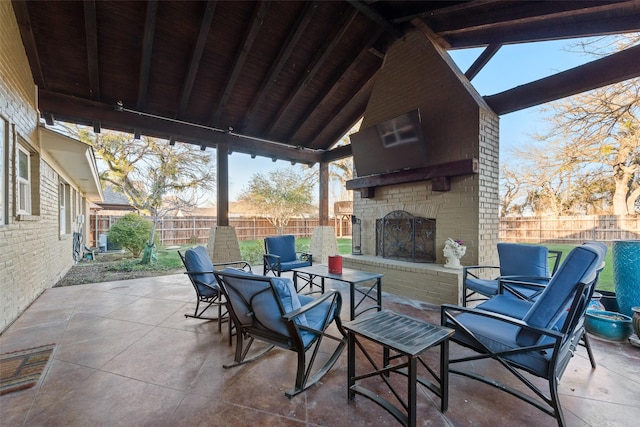 view of patio / terrace with an outdoor brick fireplace