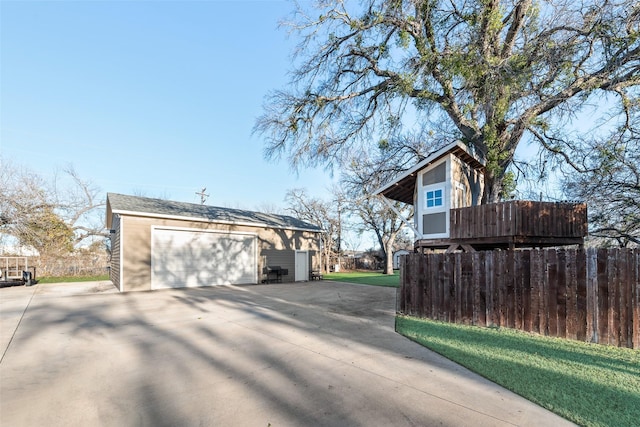 view of side of property with an outbuilding and a garage