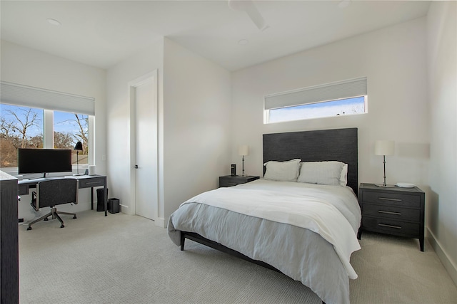 bedroom featuring light colored carpet