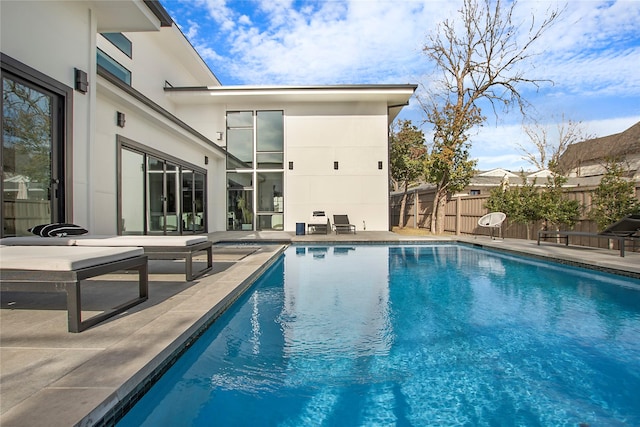 view of swimming pool with a patio area